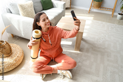 Young woman in hoodie with ...