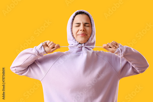 Young woman in lilac hoodie...