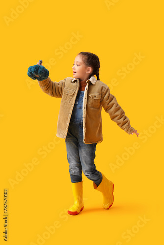 Little Asian girl in rubber...