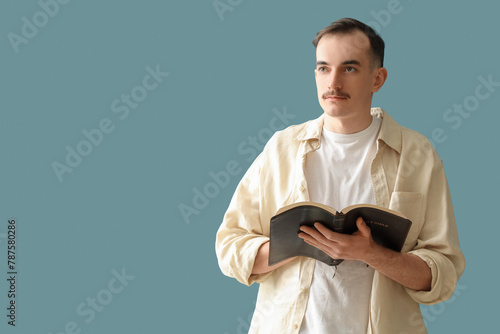Young man with Holy Bible p...