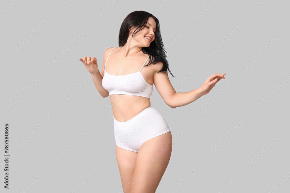 Body positive woman in underwear on light background Body positive woman in underwear on light background