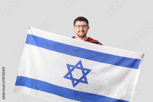 Young Jewish man with flag ...