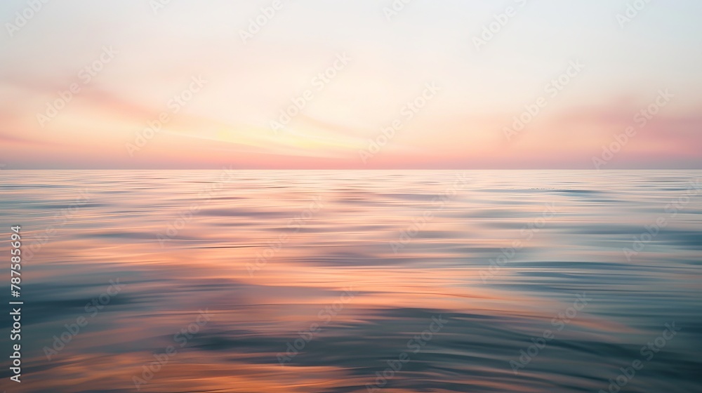 Tranquil ocean sunset with pastel sky