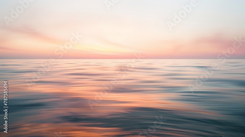 Tranquil ocean sunset with pastel sky