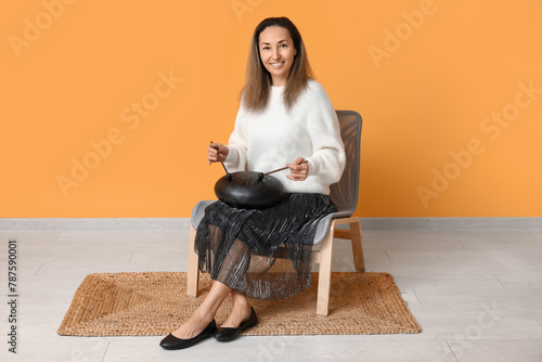 Happy mature woman with sti...