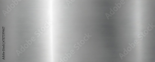 Close-up of a brushed metal surface with vertical lines and gradient shading from light to dark gray