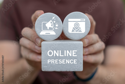 Fotografie Man holding white blocks with icons sees inscription: ONLINE PRESENCE