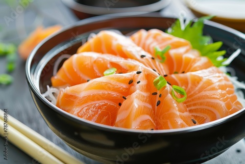 Oriental Japanese food bowl with Kani raw salmon and chopsticks on white and black backgrounds