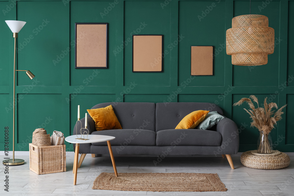 Stylish interior of green living room with cozy sofa, coffee table and carpet - obrazy, fototapety, plakaty 