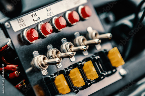 Fotografia Buttons and switches of a race car control panel.