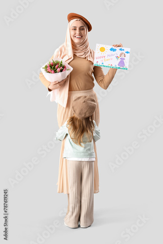 Young Muslim woman with gif...