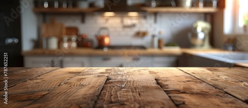 Wooden table surface against a blurred kitchen backdrop, suitable for showcasing products or designing visual layouts.