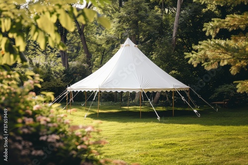 a white tent in the yard photo