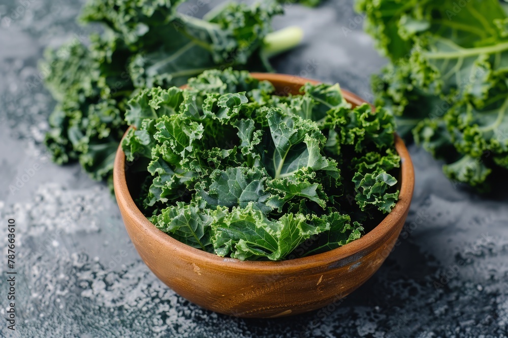 bowl of kale chips beside fresh kale bowl of kale chips beside fresh kale