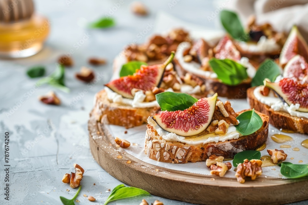 Fig honey goat cheese and walnut bruschetta on light background focused on walnut Fig honey goat cheese and walnut bruschetta on light background focused on walnut
