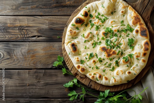 Top view of naan bread on wood background photo
