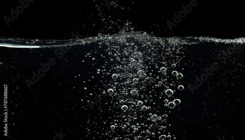 Bubbles emerging from below, underwater, gushing, carbonic acid, liquid, water, surging, black background, close-up