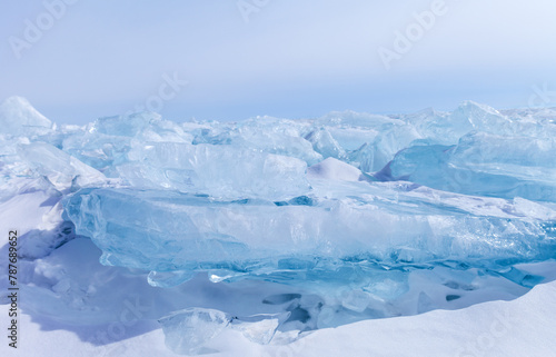 Natural ice empty podium or pedestal for advertising cosmetics, beauty products, drinking water or small goods. Abstract blue cold winter background. Baikal Lake landscape with pile of blue ice floes