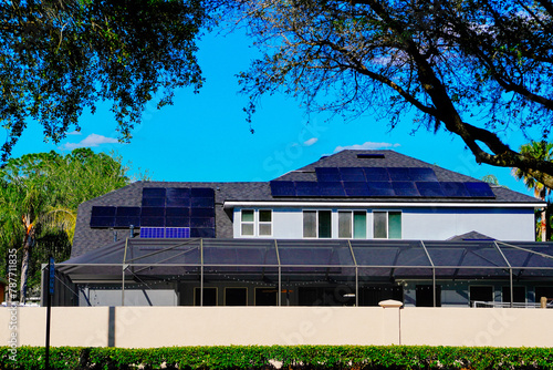 Solar panel on a house roof; Green energy from sun	