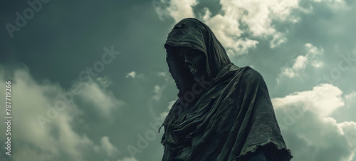 A person in a hooded robe Silhouette of hooligan on black background with smoke. photo