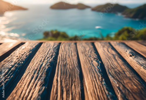 Wooden table overlooking a scenic tropical bay with lush green islands and turquoise water, ideal for travel and nature themes. photo
