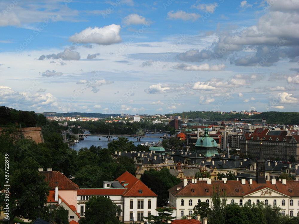 Fototapeta premium Aerial View of City Buildings in Prague, Czech Republic with blue sky and clouds
