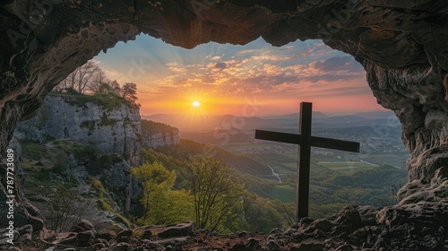 Sunset view of a wooden cross from a cave