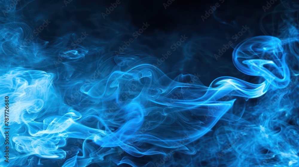 Blue smoke set against a black background.
Blue smoke set against a black background.