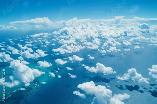 An expansive aerial vista of a vast ocean expanse, with azure waters stretching to the horizon and fluffy clouds drifting lazily overhead, Generative AI