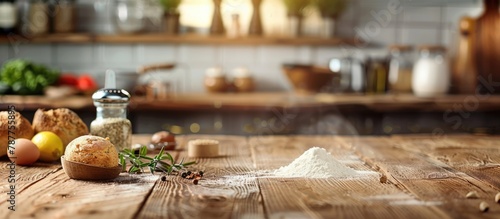 Baking ingredients set out on a wooden table, prepared for cooking, with space for adding text. Depicts the idea of food preparation, with a kitchen background.