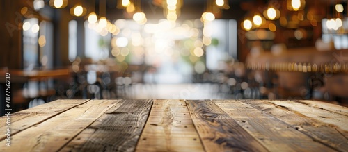 Restaurant interior background with a blurred abstract setting featuring an empty wooden table. Mock up included.