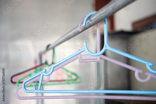 Colorful clothes hanger in a shop, closeup of photo photo