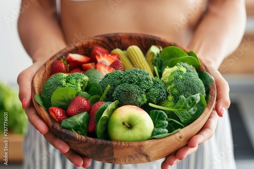 person holding a bowl of fruits and vegetables, healthy food, healthy lifestyle, wellness