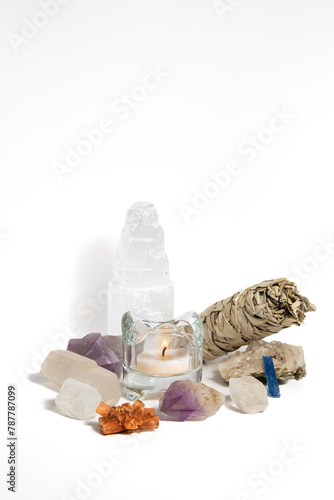 Crystals and Sage with candle isolated white background vertical composition with negative space photo