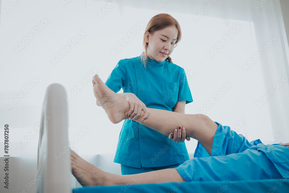 Physical therapy assistance Asian female doctor with senior man in physical therapy rehabilitation or health support Female physical therapist or physical therapist counseling an elderly patient. Physical therapy assistance Asian female doctor with senior man in physical therapy rehabilitation or health support Female physical therapist or physical therapist counseling an elderly patient.