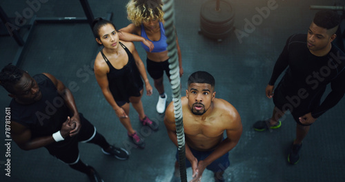Man, group and rope for climbing in gym with challenge, start and training for strong muscle growth. Personal trainer, people or friends with exercise, workout and vision for coaching at fitness club