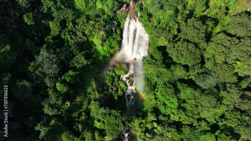 Curug Sewu Waterfall in the Middle of Indonesian Green Forest photo