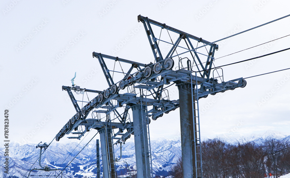 Structure steel lift or ropeway to go skiing snow covered with sky is overcast. People using chairlift at mountain ski resort. Winter vacation. Famous ski resort far from Tokyo, Gala Yuzawa Japan. Structure steel lift or ropeway to go skiing snow covered with sky is overcast. People using chairlift at mountain ski resort. Winter vacation. Famous ski resort far from Tokyo, Gala Yuzawa Japan.