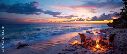 A beach scene with a table and chairs set up for a romantic dinner photo