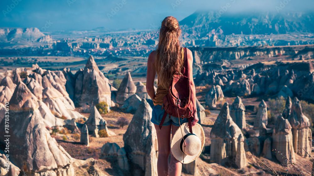 Female tourist enjoying Cappadocia landscape in Turkey