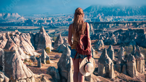 Female tourist enjoying Cappadocia landscape in Turkey photo