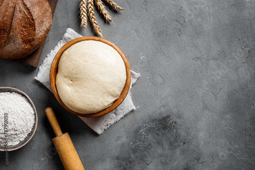 Baking and kneading background with ball of dough © mizina
