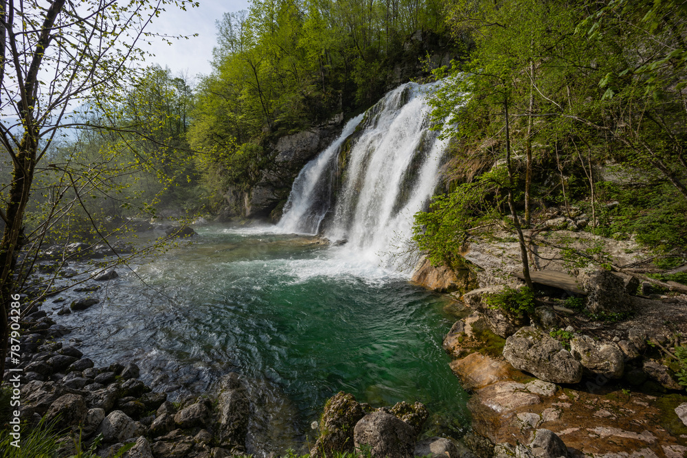 Bovec, Slovenia. Visje waterfalls. Nature trail crystal clear, turquoise water. easy trekking, nature experience, wood path. Waterfalls inside a forest, long photographic exposure, power of nature. Bovec, Slovenia. Visje waterfalls. Nature trail crystal clear, turquoise water. easy trekking, nature experience, wood path. Waterfalls inside a forest, long photographic exposure, power of nature.