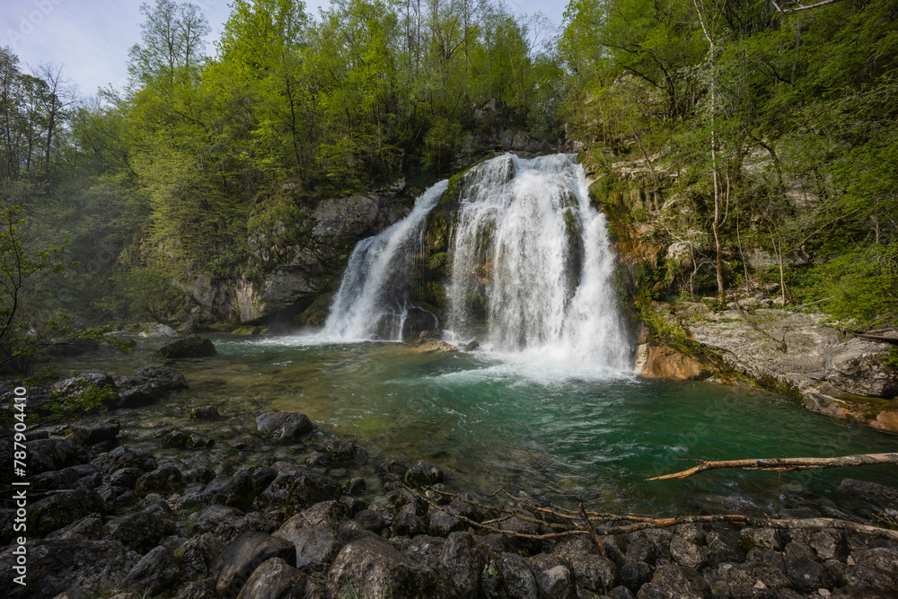 Bovec, Slovenia. Visje waterfalls. Nature trail crystal clear, turquoise water. easy trekking, nature experience, wood path. Waterfalls inside a forest, long photographic exposure, power of nature.