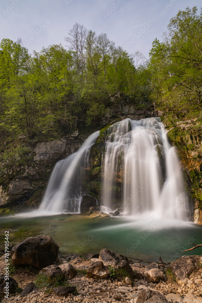 Bovec, Slovenia. Visje waterfalls. Nature trail crystal clear, turquoise water. easy trekking, nature experience, wood path. Waterfalls inside a forest, long photographic exposure, power of nature.