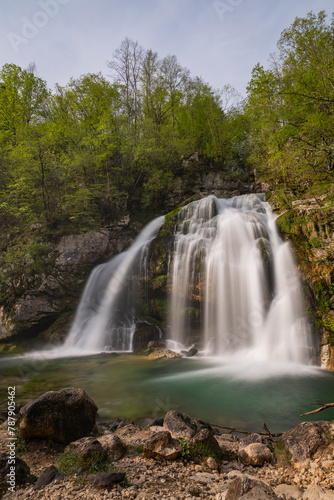 Bovec  Slovenia. Visje waterfalls. Nature trail crystal clear  turquoise water. easy trekking  nature experience  wood path. Waterfalls inside a forest  long photographic exposure  power of nature.