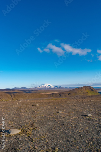 Cover page with Icelandic landscape of the deadliest volcanic desert in Highlands, with stones and rocks thrown by volcanic eruptions, Iceland, summer, blue sky.