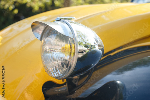 Old yellow citroen headlight.
