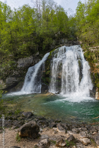 Bovec  Slovenia. Visje waterfalls. Nature trail crystal clear  turquoise water. easy trekking  nature experience  wood path. Waterfalls inside a forest  long photographic exposure  power of nature.