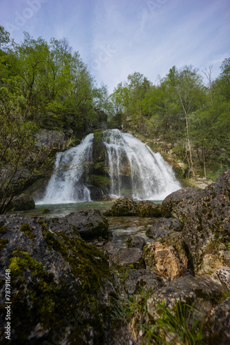 Bovec  Slovenia. Visje waterfalls. Nature trail crystal clear  turquoise water. easy trekking  nature experience  wood path. Waterfalls inside a forest  long photographic exposure  power of nature.